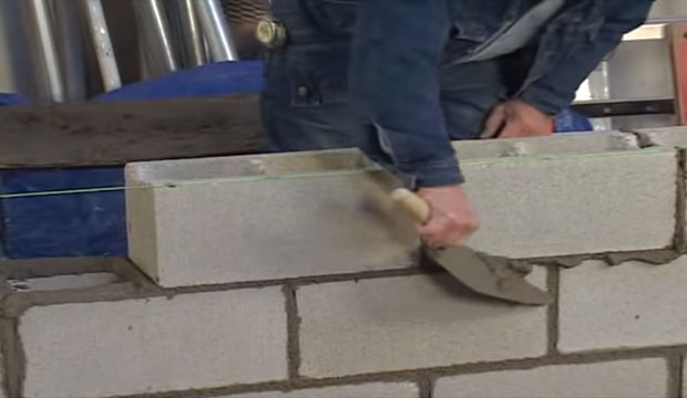 Detailed processes for bond beam concrete block construction.